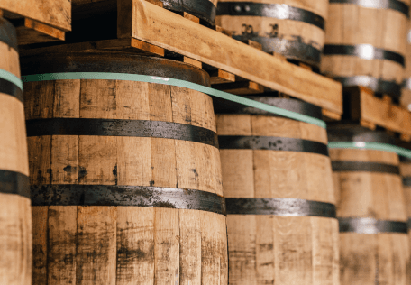 New fill barrels stacked on wooden racks